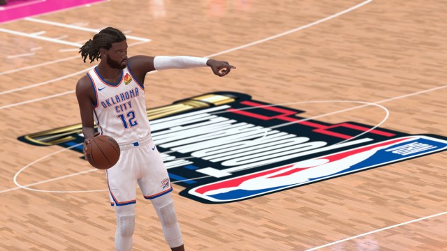 A basketball player for Oklahoma City Thunder points while bouncing the ball in NBA 2K24.