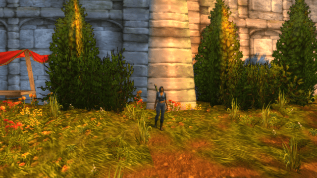 Image of a female human paladin standing in front of a brick wall.